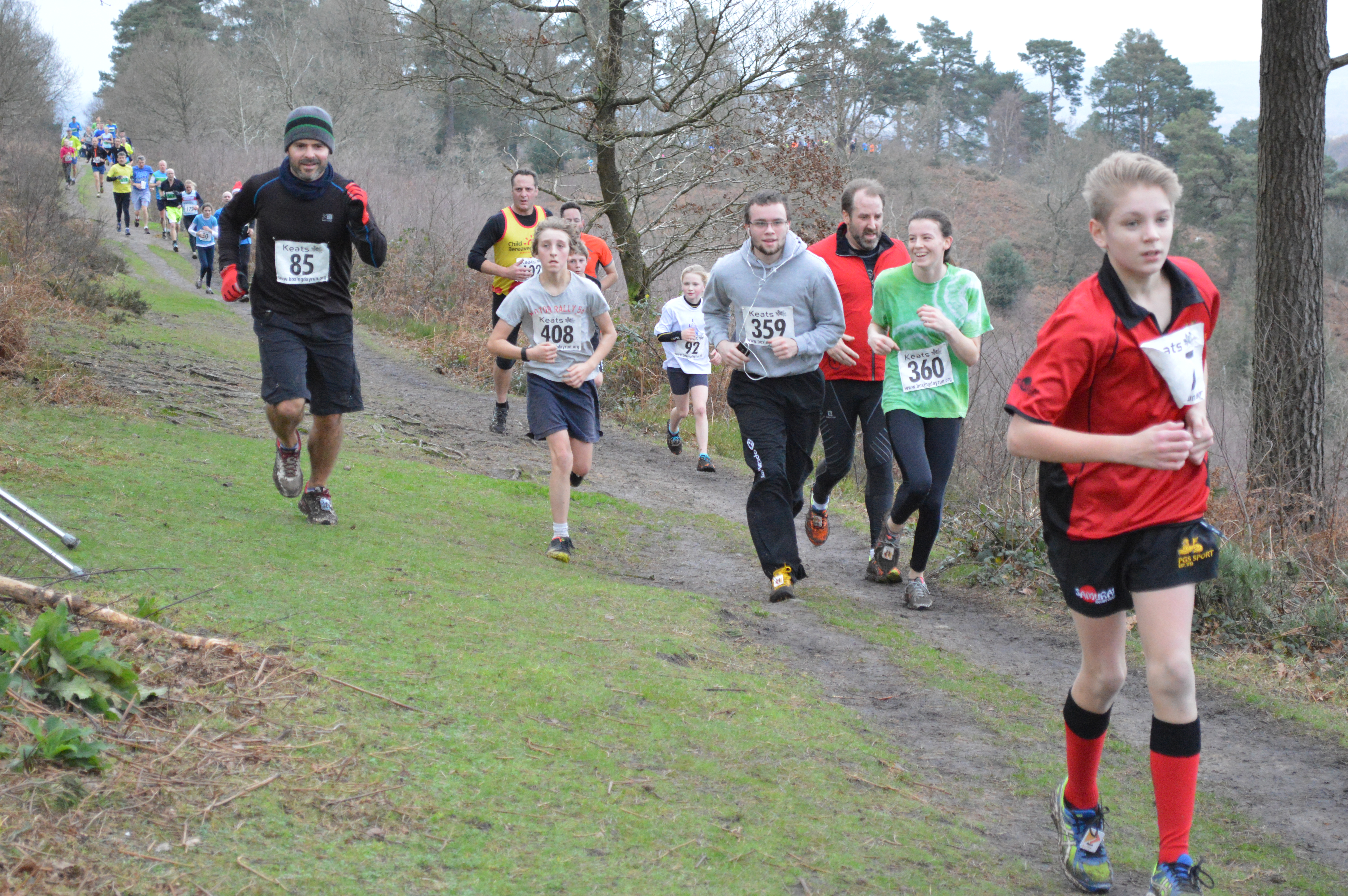 Stream of runners with the beer stop in the distance